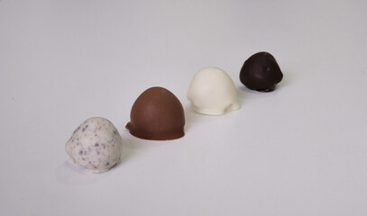raspberries dipped or covered in mold chocolate . white chocolate, milk chocolate, dark chocolate...
