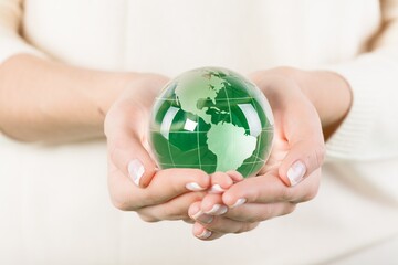 Small globe held by a person