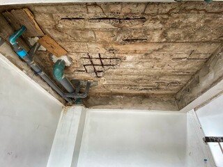 The structure of the house where the cement is peeled off until the rusty iron is seen causing the house to deteriorate.