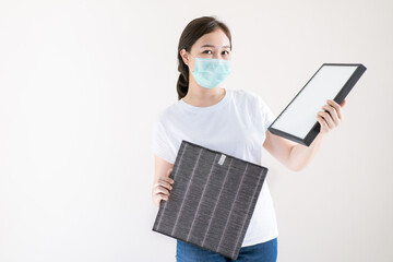 Woman replacing air filter close up.