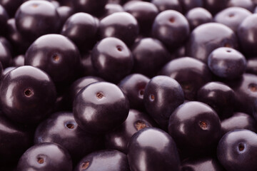 Fresh ripe acai berries as background, closeup