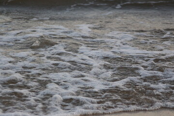 Water flowing on the beach
