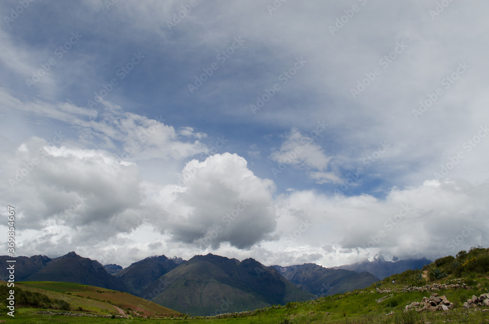 Wall mural clouds over mountain