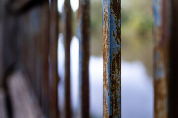 rusty metal fence bars