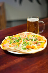 Pizza and beer on table