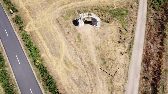 Tilting aerial view of Arco de San Miguel de Mazarreros in Burgos, Spain