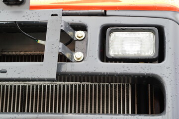 The working light of a modern tractor. Lighting equipment of a modern tractor.