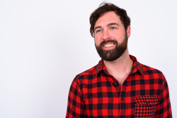 Portrait of happy handsome bearded hipster man