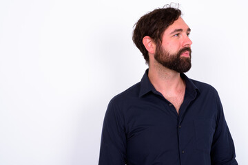 Obraz premium Portrait of handsome bearded businessman against white background
