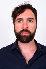 Portrait of handsome bearded businessman against white background