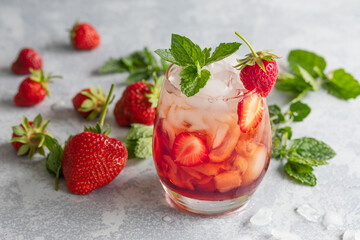 Strawberry drink mocktail or cocktail with strawberries and fresh mint leafs