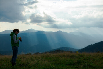Fototapeta premium photographer in Ukraine Carpathians shoots a landscape