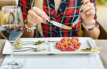 Obraz na płótnie Canvas gourmet tartar with fresh herbs