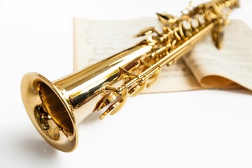 Obraz na płótnie Canvas Soprano Saxophone On Music Book Close-up