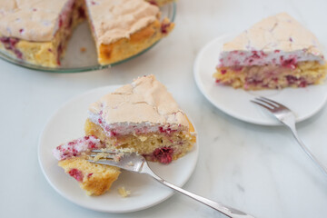 Sweet home made raspberry merigue pie on a table