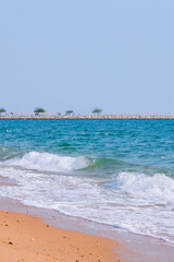 Caribbean beach with golden sand, emerald water and blue sky with clouds. Empty beach. Copy space banner.