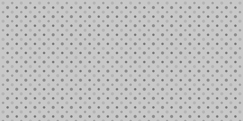 互い違いに配置された大きさと色の異なるドット模様