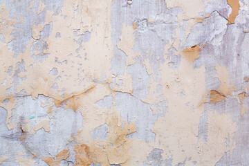 Concrete, weathered, worn, damaged wall paint. Rough, concrete surface with cracks and scratches. Great background or texture.