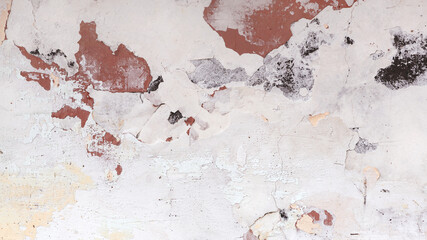 Concrete, weathered, worn, damaged wall paint. Rough, concrete surface with cracks and scratches. Great background or texture.