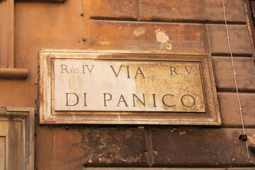 old street name sign on the wall