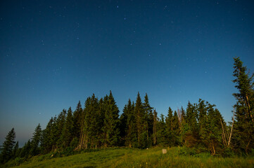 Fototapeta na wymiar Moon and starry night in the Carpathians