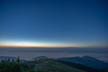 The night sky in the Carpathian mountains before sunrise