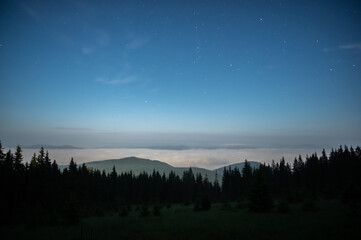 The night sky in the Carpathian mountains before sunrise