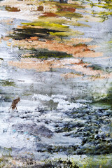 Abstract creative background of chaotic strokes of old cracked paint on concrete wall. Old surface with traces of paint, weathered, scratches and cracks for design