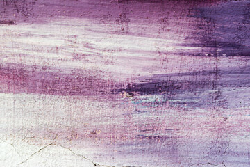 Abstract creative background of chaotic strokes of old cracked paint on concrete wall. Old surface with traces of paint, weathered, scratches and cracks for design