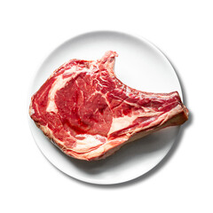 Prime rib raw meat on a white plate background