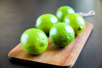lime on wooden cutting board 