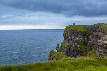The Cliff of Moher, a landmark in west side of Ireland, on a cloudy day.