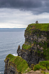 Fototapeta na wymiar The Cliff of Moher, a landmark in west side of Ireland, on a cloudy day.
