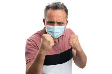 Man showing fists wearing surgical mask as covid19 concept