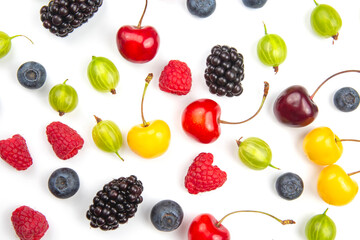 Assorted fresh different berries on a white background. useful vitamin healthy food fruit. healthy vegetable breakfast