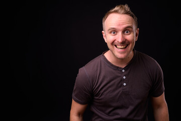 Portrait of happy handsome man with blond hair