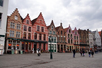 Obraz premium View of the colorful houses in traditional Flemish style on Grote Markt or Market Square in Bruges, Belgium