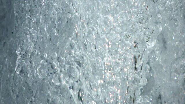 とめどなく溢れる水  水飛沫  水資源  接写  4K / Closeup of water fountain. Abstract aqua background. Rain. Water droplets splashing. 