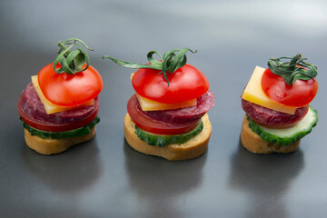 light sandwiches made of vegetables, cheese and sausages. fast food and breakfast