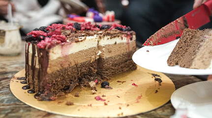piece of chocolate cake on plate, cutting three mousse chocolate cake, white milk and black chocolate, celebrating a birthday, delicious homemade cake