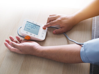 Checking blood pressure with measuring device digital blood pressure monitor