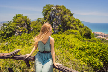 Woman tourist on the background of Beautiful Marble mountains and Da Nang, Vietnam