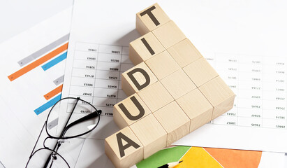 AUDIT words with wooden blocks. Business concept.