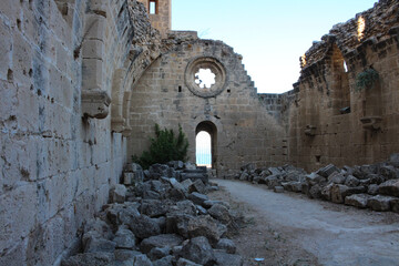 View of the ruins of the wall and the carved window of Bellapais Abbey. White Abbey, the Abbey of the Beautiful world. Kyrenia. Cyprus...