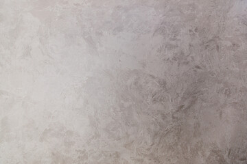 Texture of gray decorative plaster with the effect of wet silk. Hand made. Abstract background.