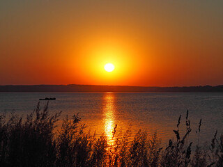 Sunset. Grass. River. Summer. Russia, Ural, Perm region