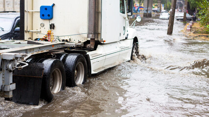 Odessa, Ukraine - September 20, 2016: Driving cars on a flooded road during flooding caused by...