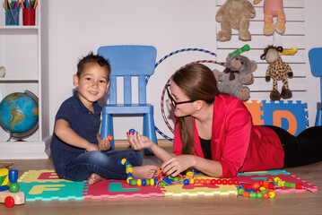 Shot of a speech therapist during a session with a little boy