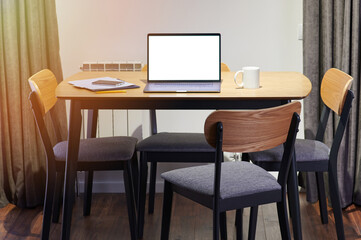 Table with laptop and documents