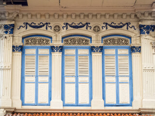 Closed shutters of a traditional shop house in Little India - Singapore